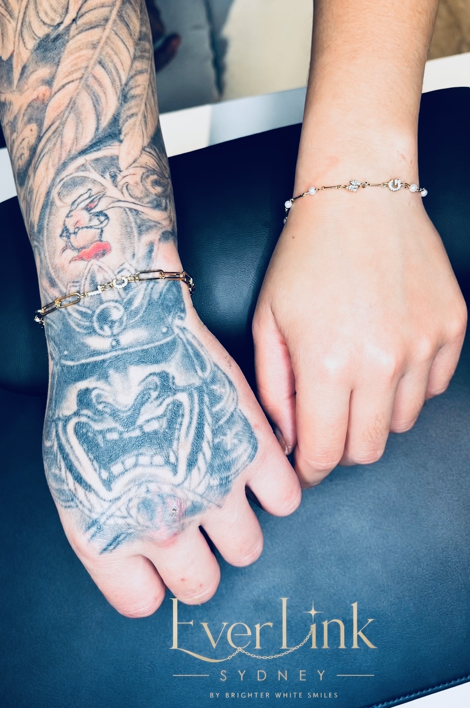A pair of personalised permanent bracelets with delicate charms