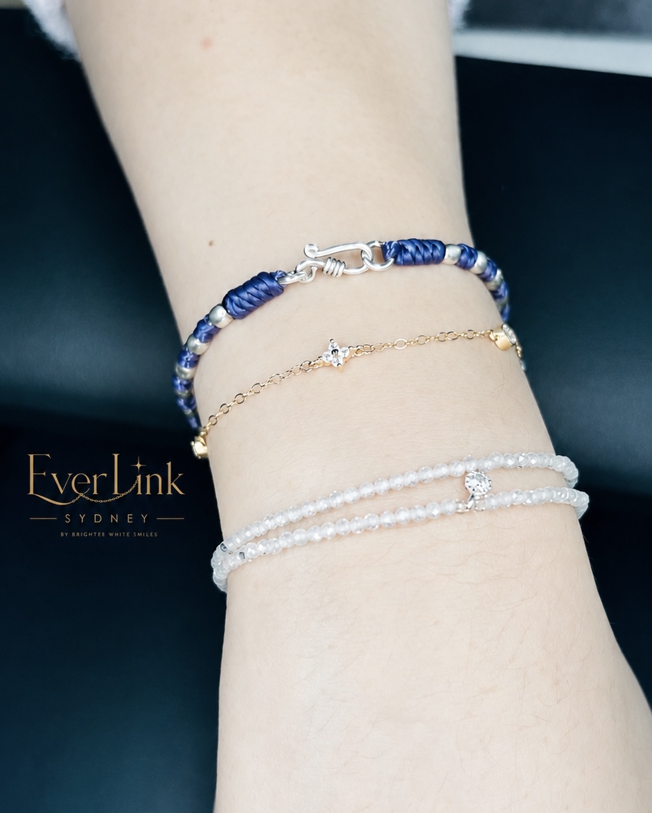 A fine gold charm bracelet styled with sentimental wrist pieces